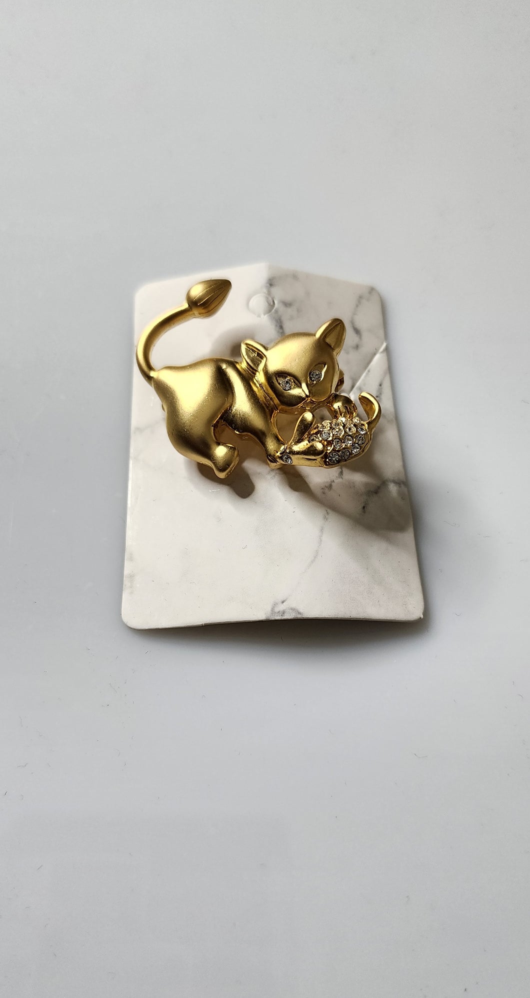 Gold cat and mouse brooch